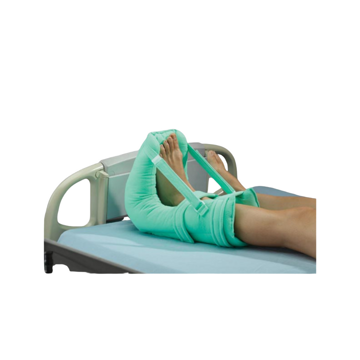 Multi-purpose heel pillow designed to address heel and foot issues like skin irritation, heel ulcers, and foot drop. Made with soft, non-shear polyester fabric and hollow core micro-fiber filling for durability. Features removable gel pad for hot/cold therapy, open heel cutout for air circulation, and adjustable foot drop control and side straps. Machine washable for easy care.