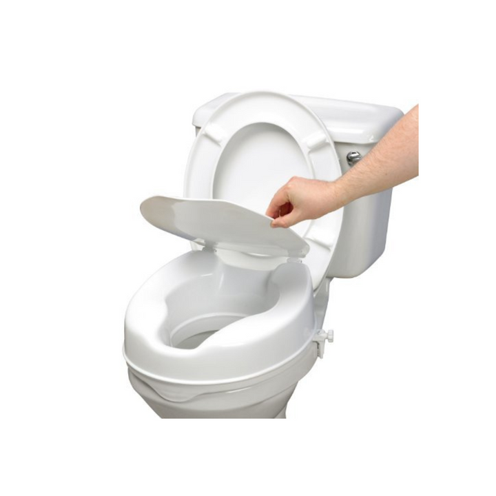 A hand lifting the lid of a toilet seat raiser