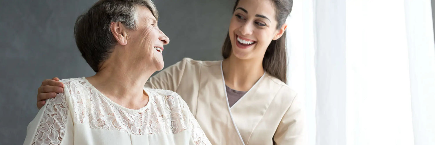 The elderly woman wears a delicate white lace blouse with intricate floral patterns and soft, flowing sleeves.