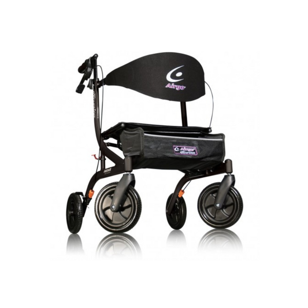 image of a walker in black with handles, brakes a seat. It has four wheels and carrier in the front of the walker