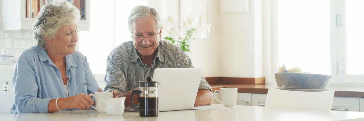 White laptop on a kitchen counter